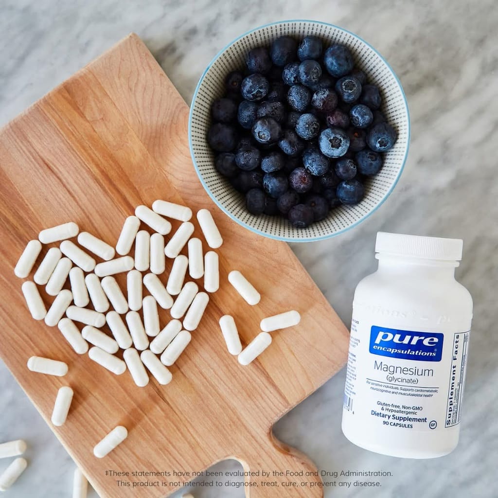 Pure Encapsulations Magnesium glycinate with capsules and a bowl of blueberries